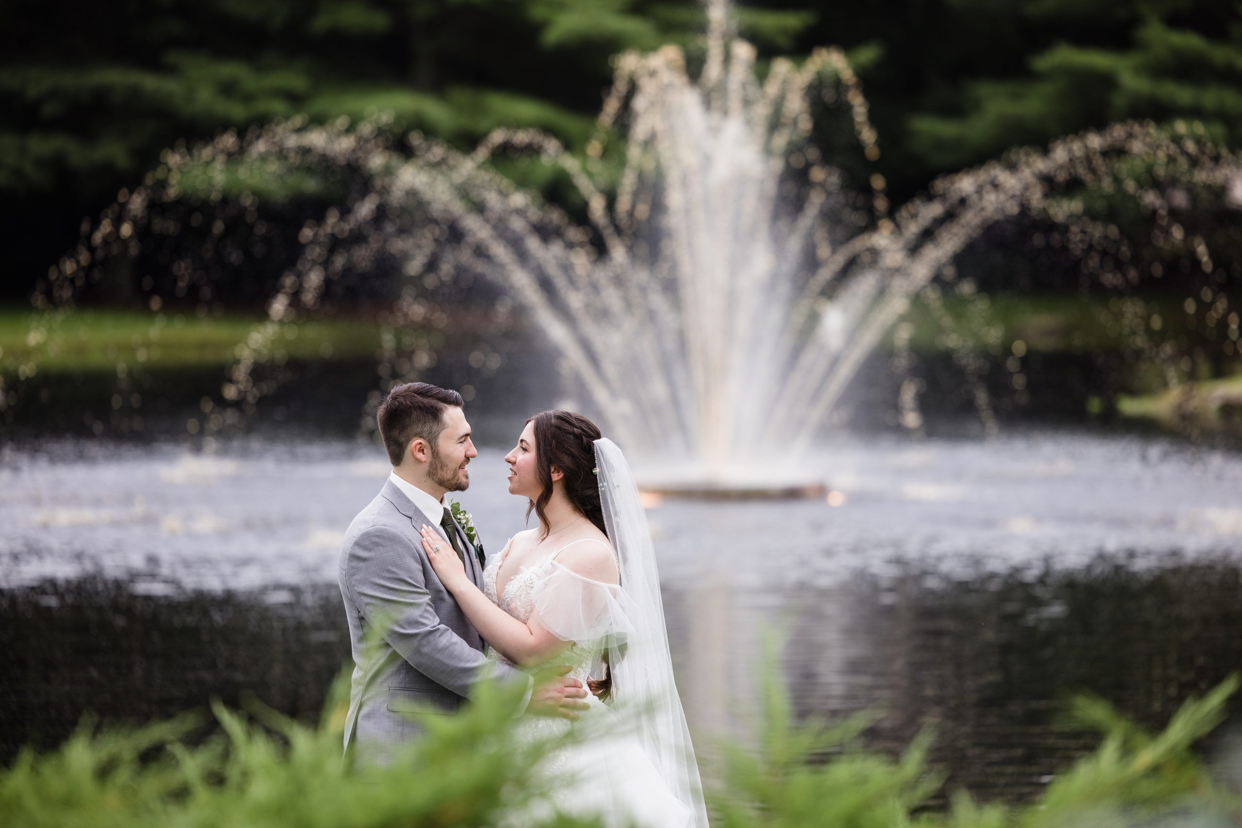 Bride and groom, water fountain.